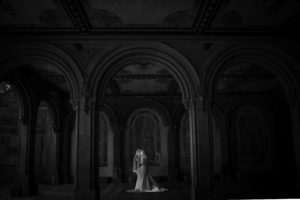dark and moody couple's portrait under bethesda terrace in central park