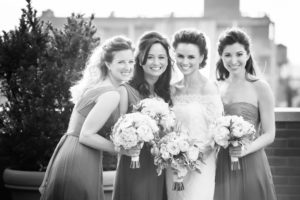 Black and white photo of bridesmaids posing for a photo during a New York wedding.