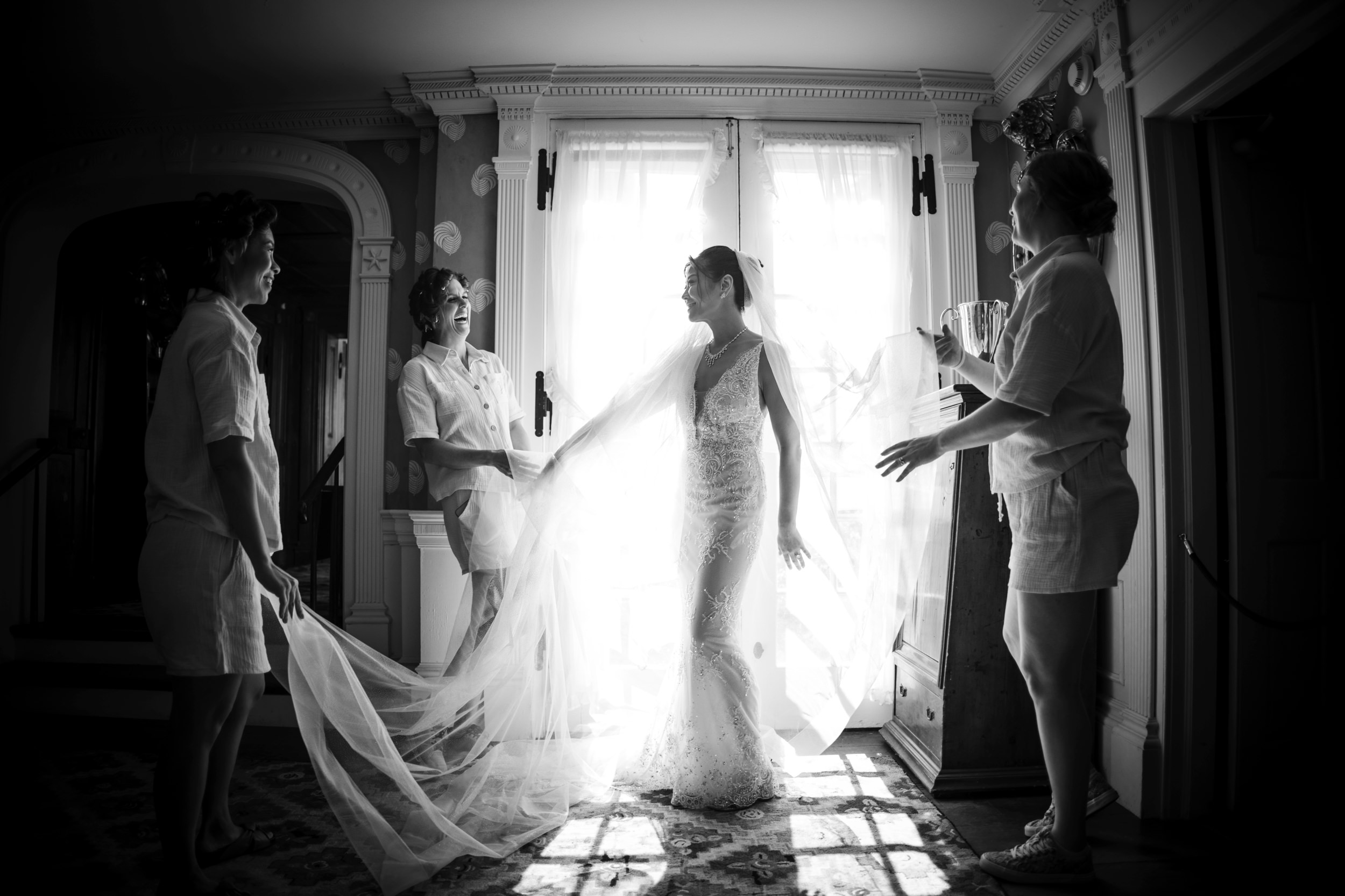 bride at window getting ready shelburne museum brock house