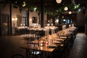 Long rectangular wedding table decorated with candles at one of the unique NYC wedding venues around the city.