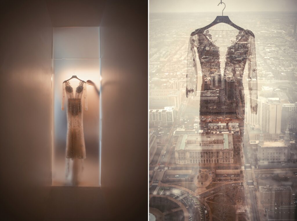 A wedding dress hangs on a hanger in a room at Four Seasons Philly with a view of the city.