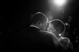 A black and white photo capturing a wedding couple's first dance at Gotham Hall.