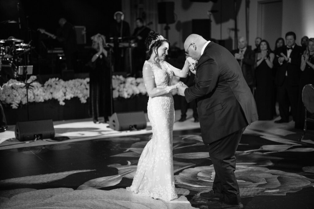 A bride and groom sharing their first dance at a wedding at the four seasons philadelphia.
