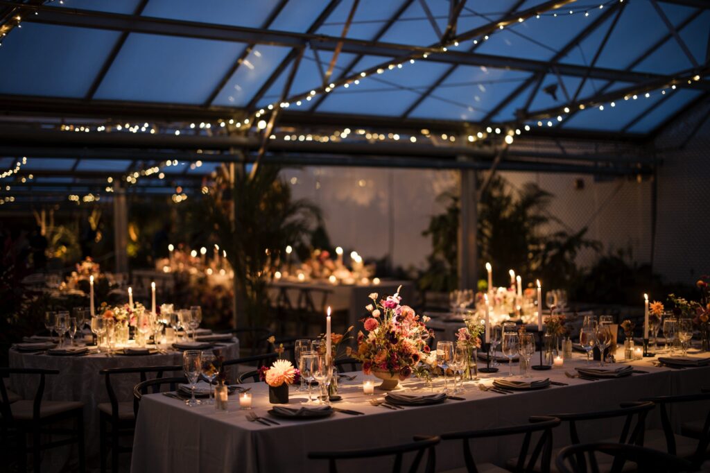 wedding reception table decor at night with string lights
