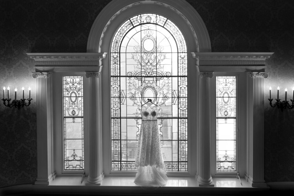 sleepy hollow country club wedding dress in stained glass window