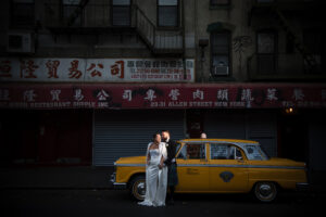 bride and groom in chinatown vintage cab nyc wedding