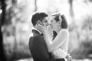 A bride and groom sharing a romantic kiss amidst the enchanting surroundings of the Brooklyn Botanic Garden Wedding venue.