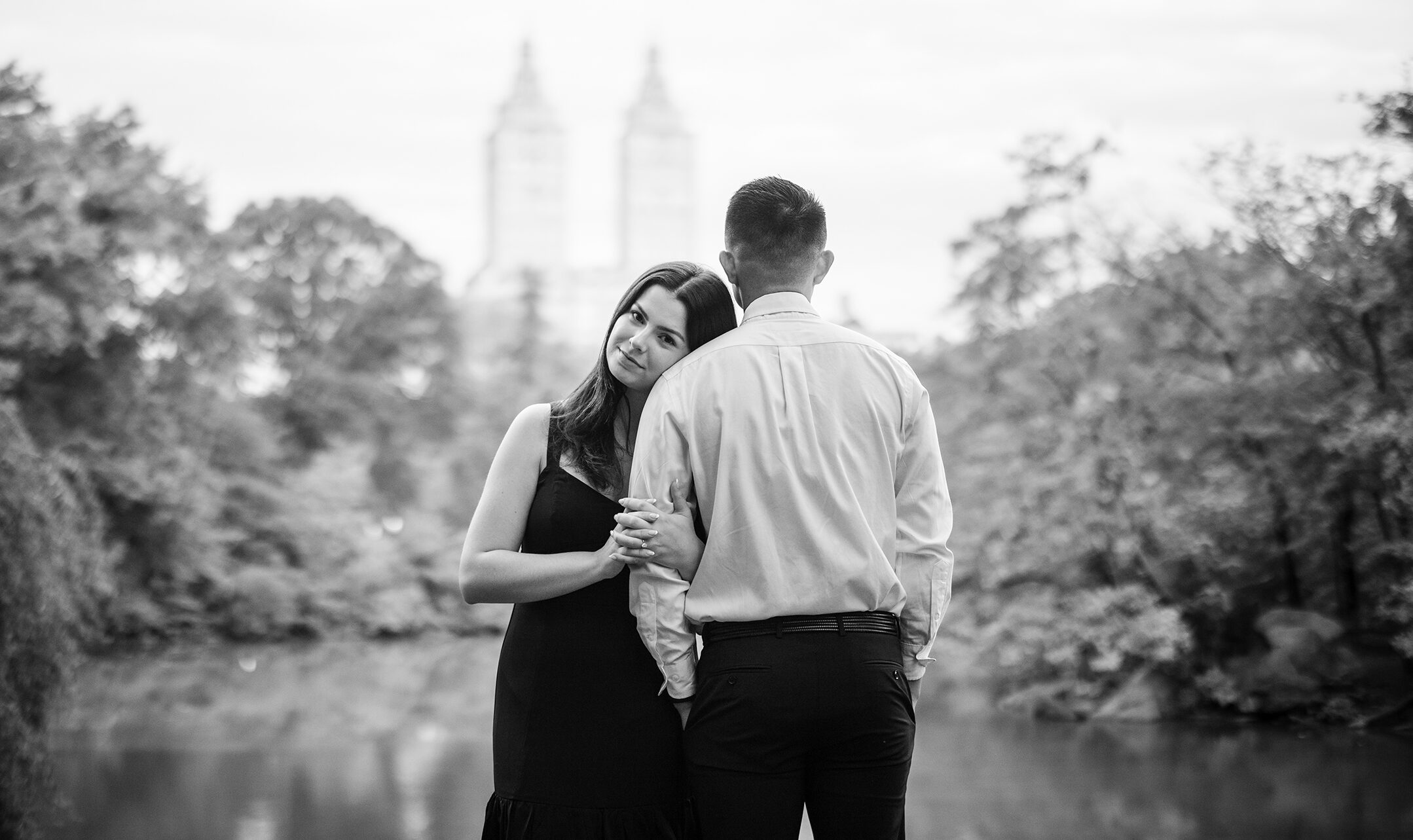 A black and white photo of a engaged couple in central park captured by a New York engagement photographer.