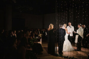 A wedding ceremony at the Filter Club with dimly lit lights creating a cozy and intimate atmosphere.