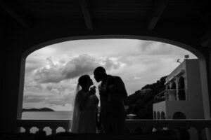 couple kissing on balcony st thomas destination wedding