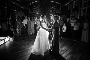 A bride and her mother dancing at a wedding
