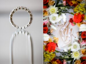 A wedding ring and flowers on a table, showcasing elegant roundhouse wedding details.