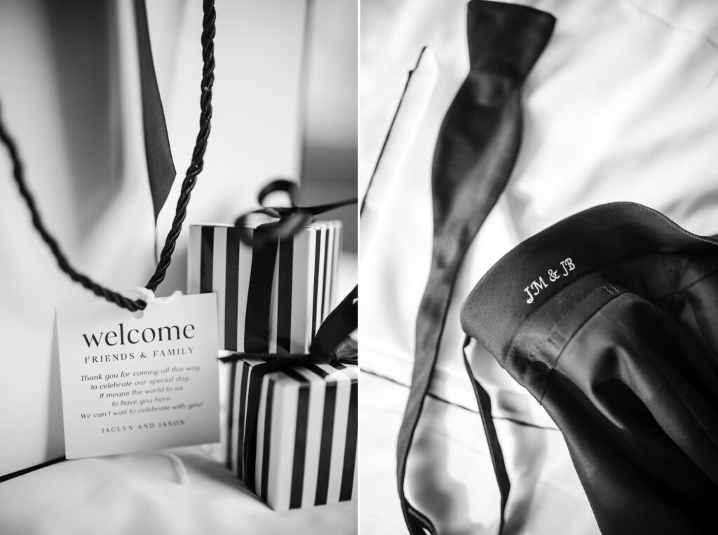 A black and white photo of a tie and a welcome sign at a Modernhaus wedding.