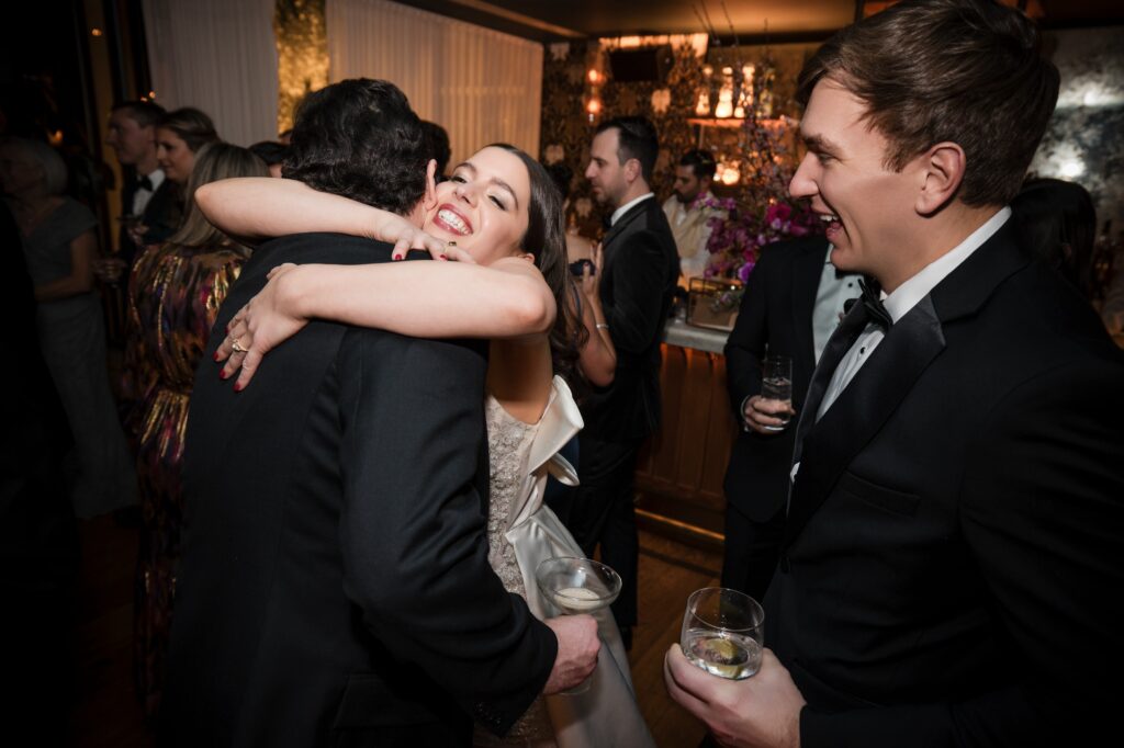 A bride and groom embracing at a Modernhaus wedding reception in Soho.