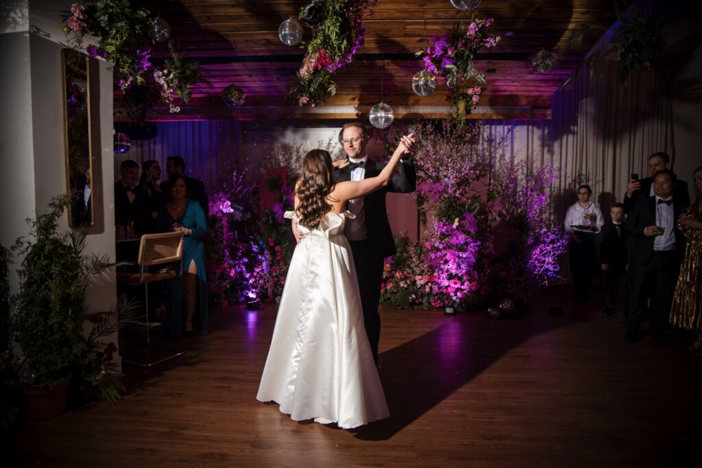 A bride and groom sharing their first dance at a Modernhaus Soho wedding reception.