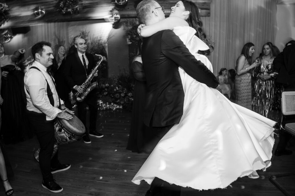 A bride and groom embracing on the dance floor at a Modernhaus Soho wedding celebration.