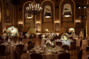 A Hotel duPont wedding reception set up in an ornate ballroom.