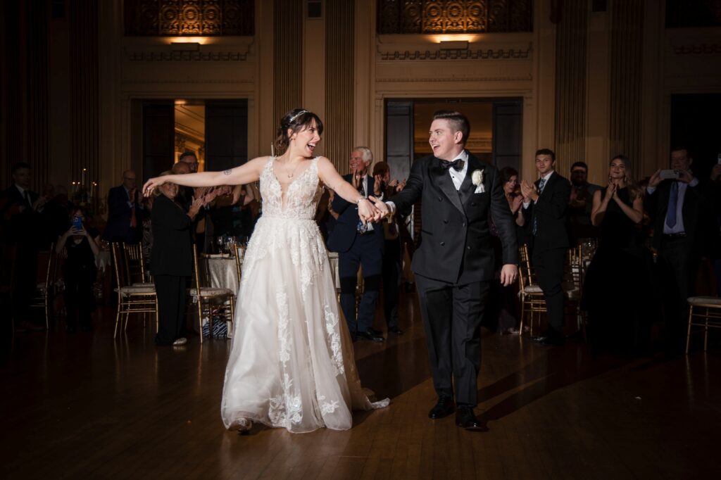 A bride and groom gracefully dance at their Hotel duPont wedding reception.