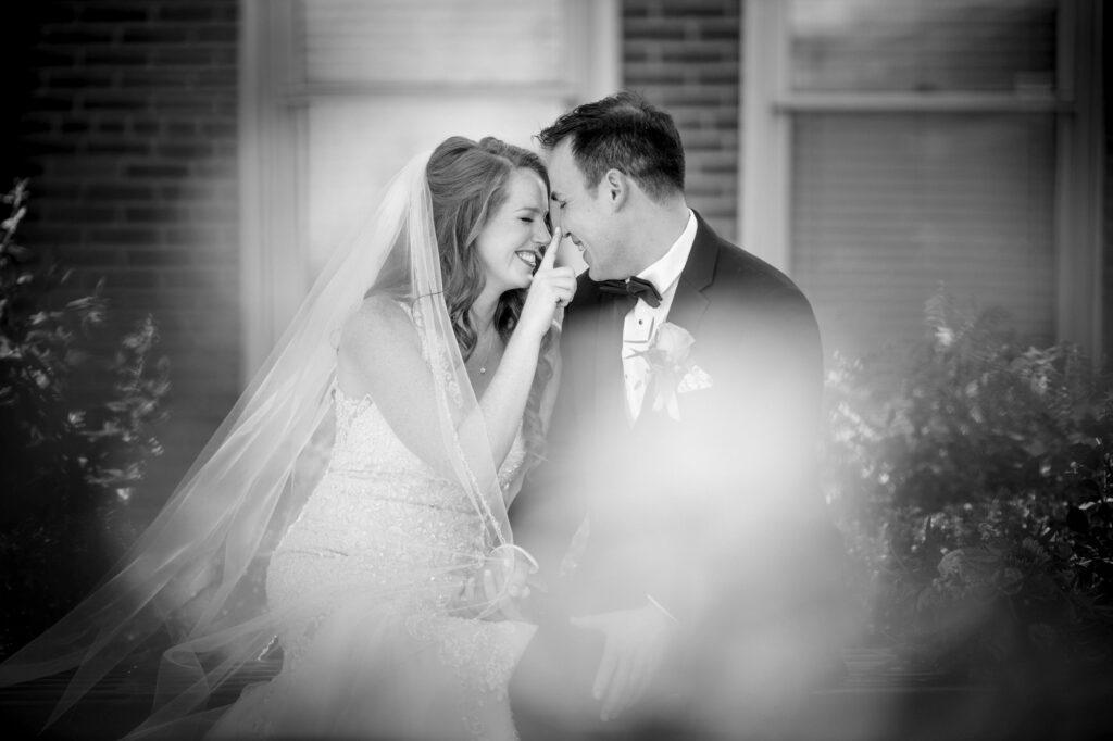 Bride and groom sharing an intimate moment on their wedding day at the Ritz-Carlton, Philadelphia.