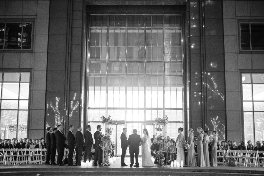 vue on 50 outdoor ceremony at night looking back towards the building