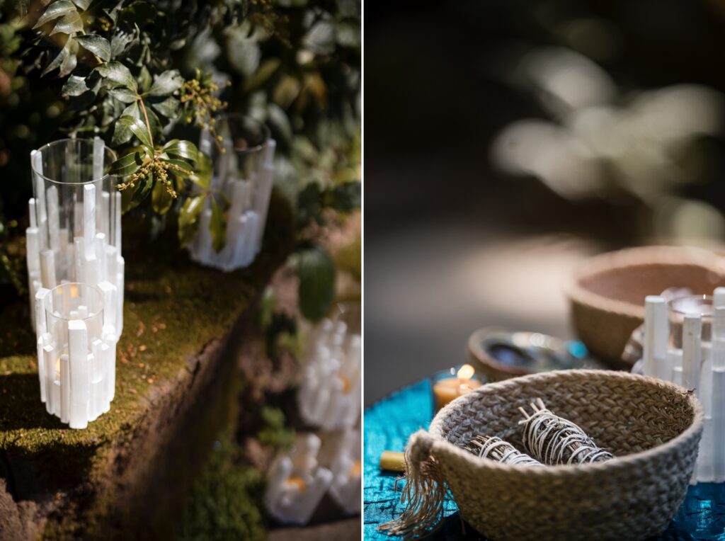 The image shows crystal candle holders on moss and ceramic bowls with smudge sticks and crystals, perfect for a Nestldown wedding table setting.