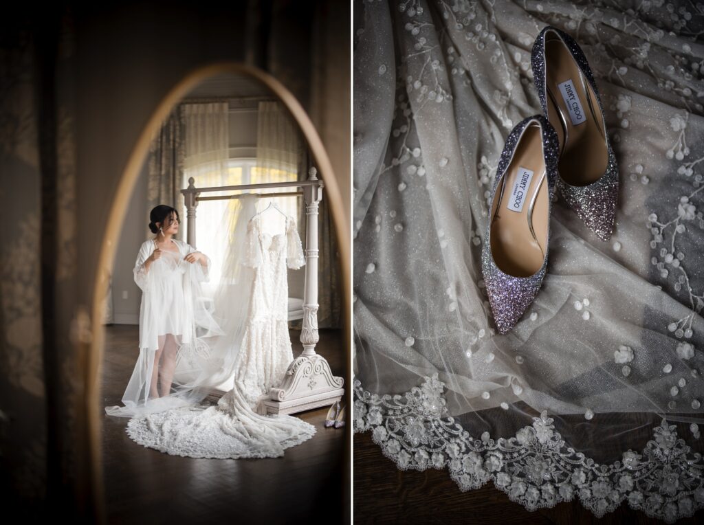 A bride in a white robe looks at a wedding dress hanging on a stand before a mirror at Park Chateau. Beside this, glittery shoes are placed on delicate lace fabric.