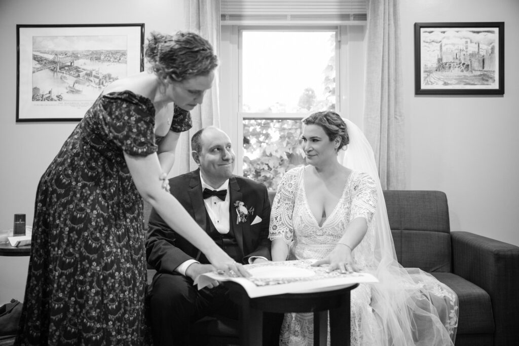 Bride and groom sign register