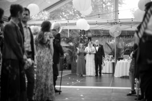 Bride and parents stand at ceremony