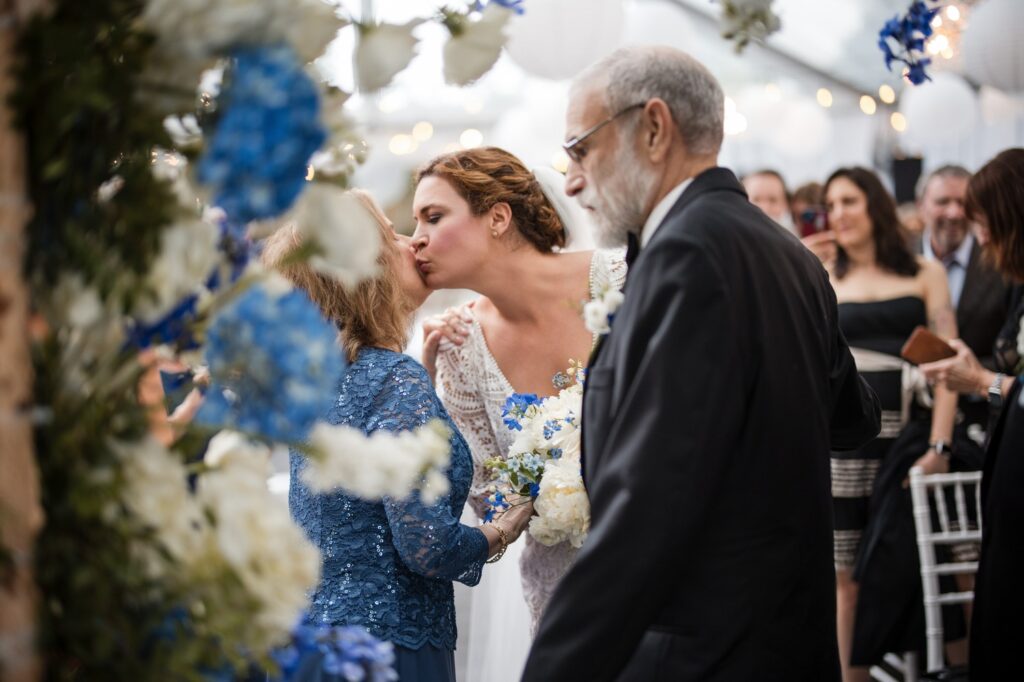 Bride kisses a member of bridal party