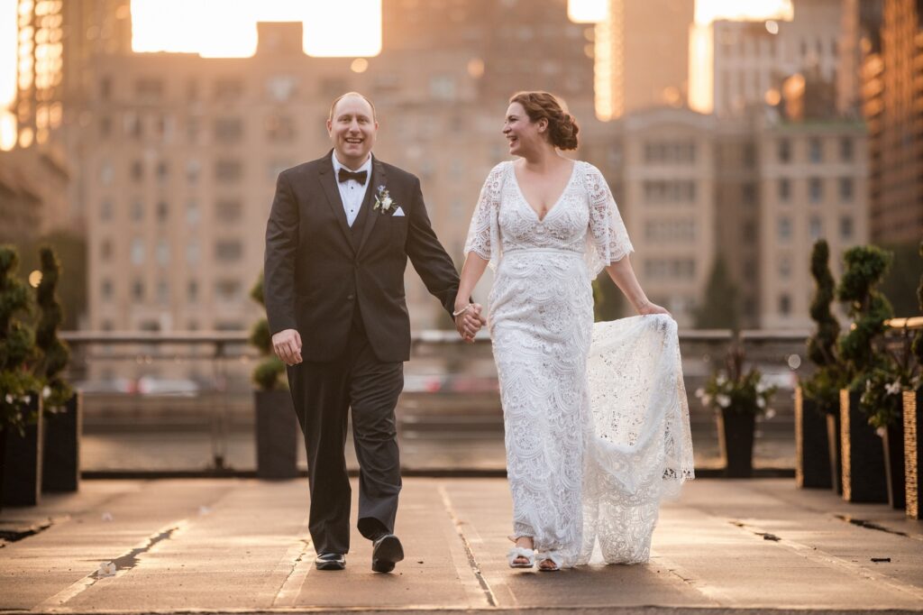 Smiling bride and groom with Manhattan skyline