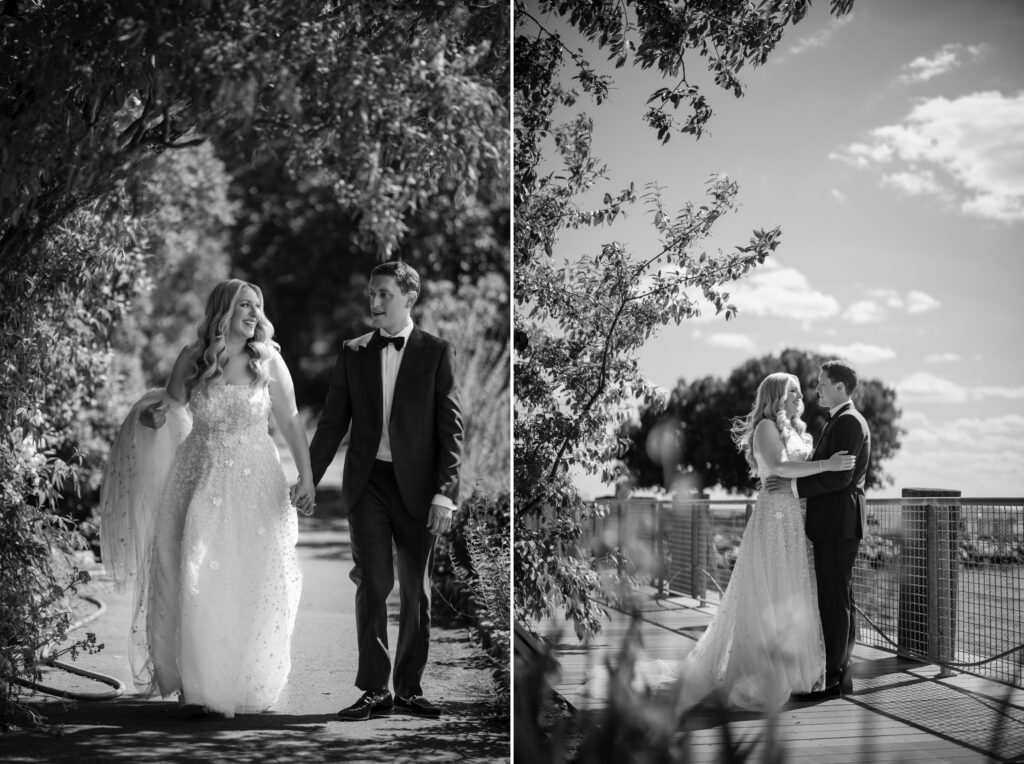 A couple, dressed in formal wedding attire, walks outdoors holding hands in one photo and embraces beside a railing in another, set against a natural, leafy backdrop. Captured at their Liberty Warehouse wedding, both images are beautifully rendered in black and white.