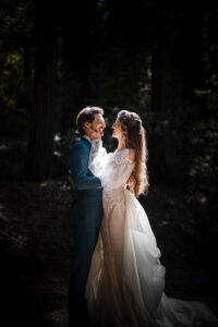 A couple hugs one another on their wedding day.