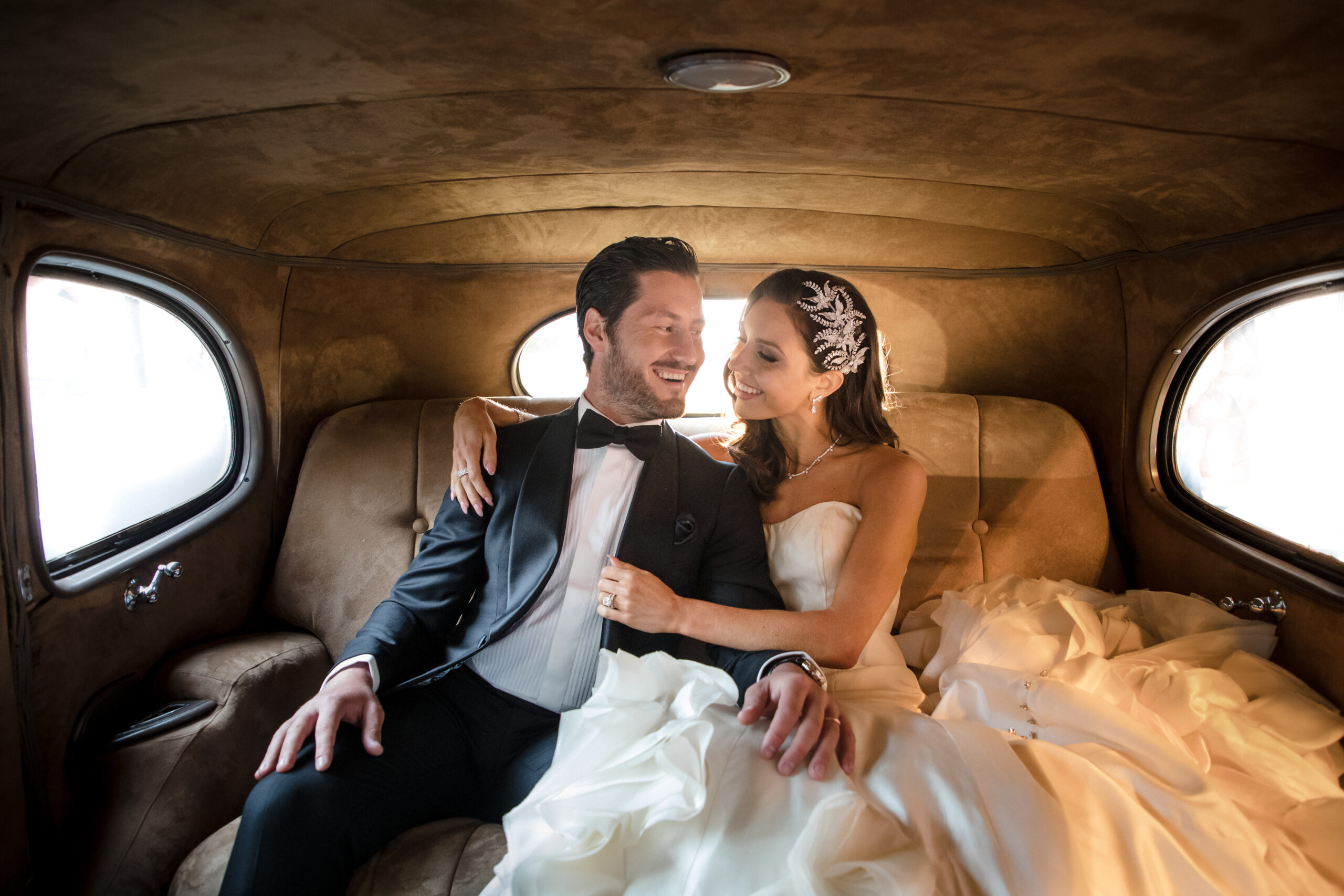 One of the couples going in a car for their destination weddings in Italy