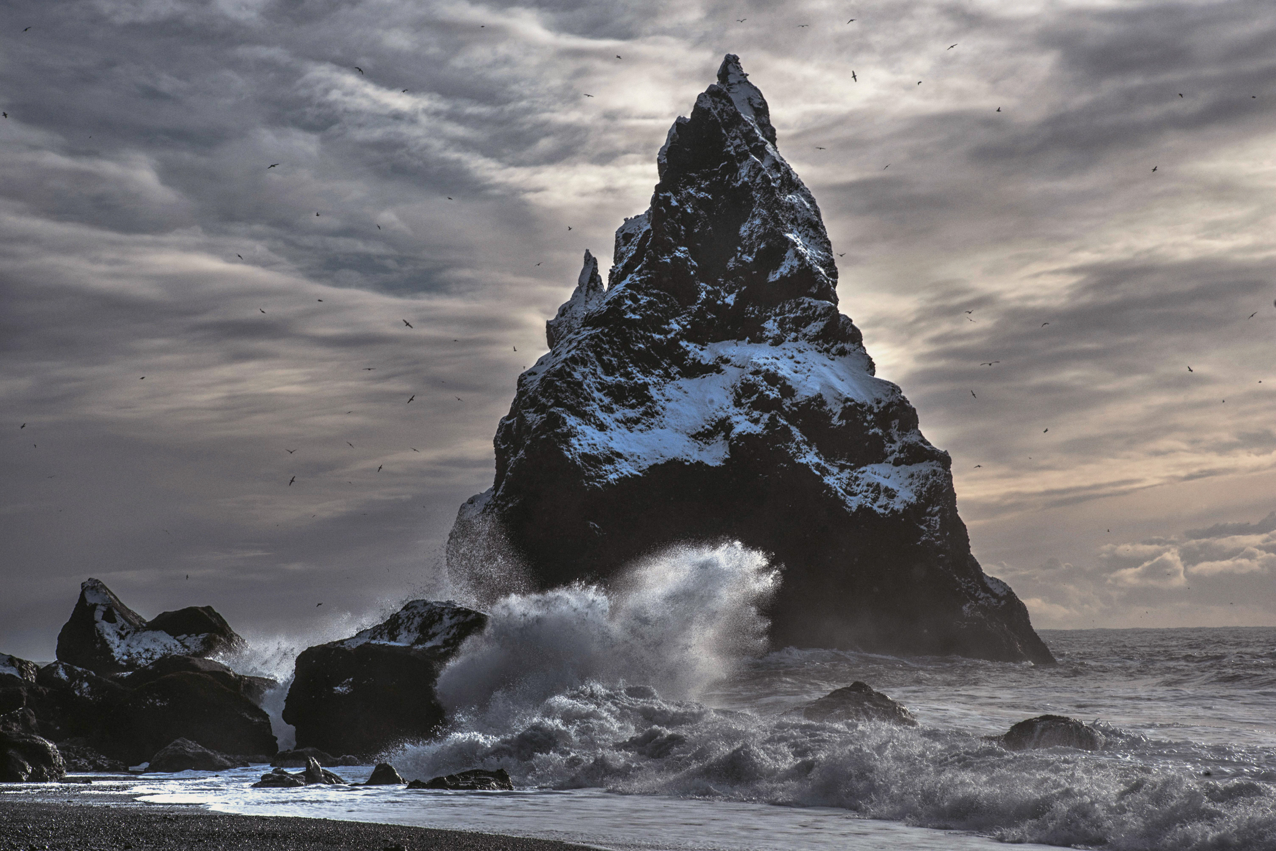 A large pointed mountain dusted with snow