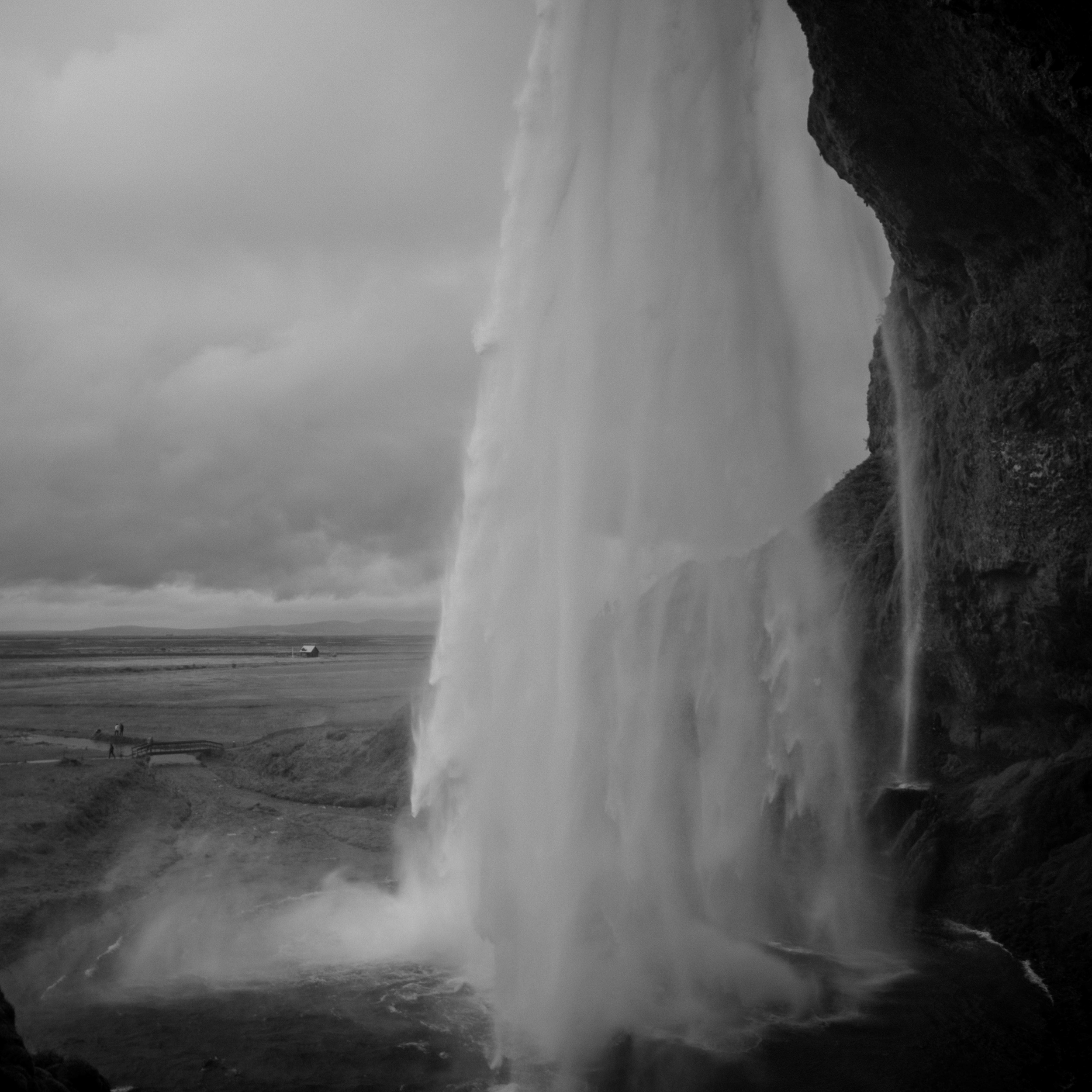 Black and white photo of a waterfall.