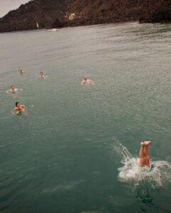 people swimming in the ocean