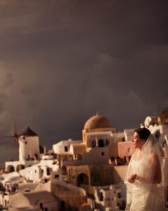 A bride enjoying her view in her wedding outfit