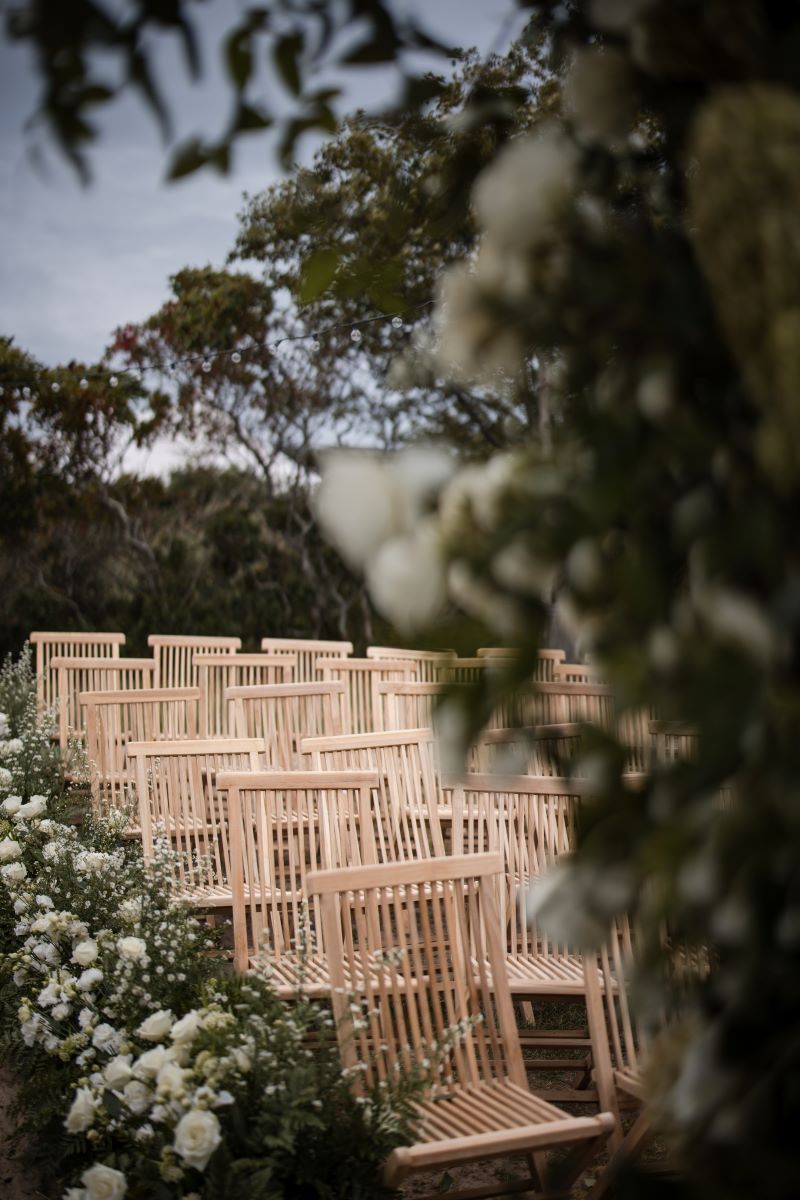 montauk wedding with wooden chairs at Crow's Nest