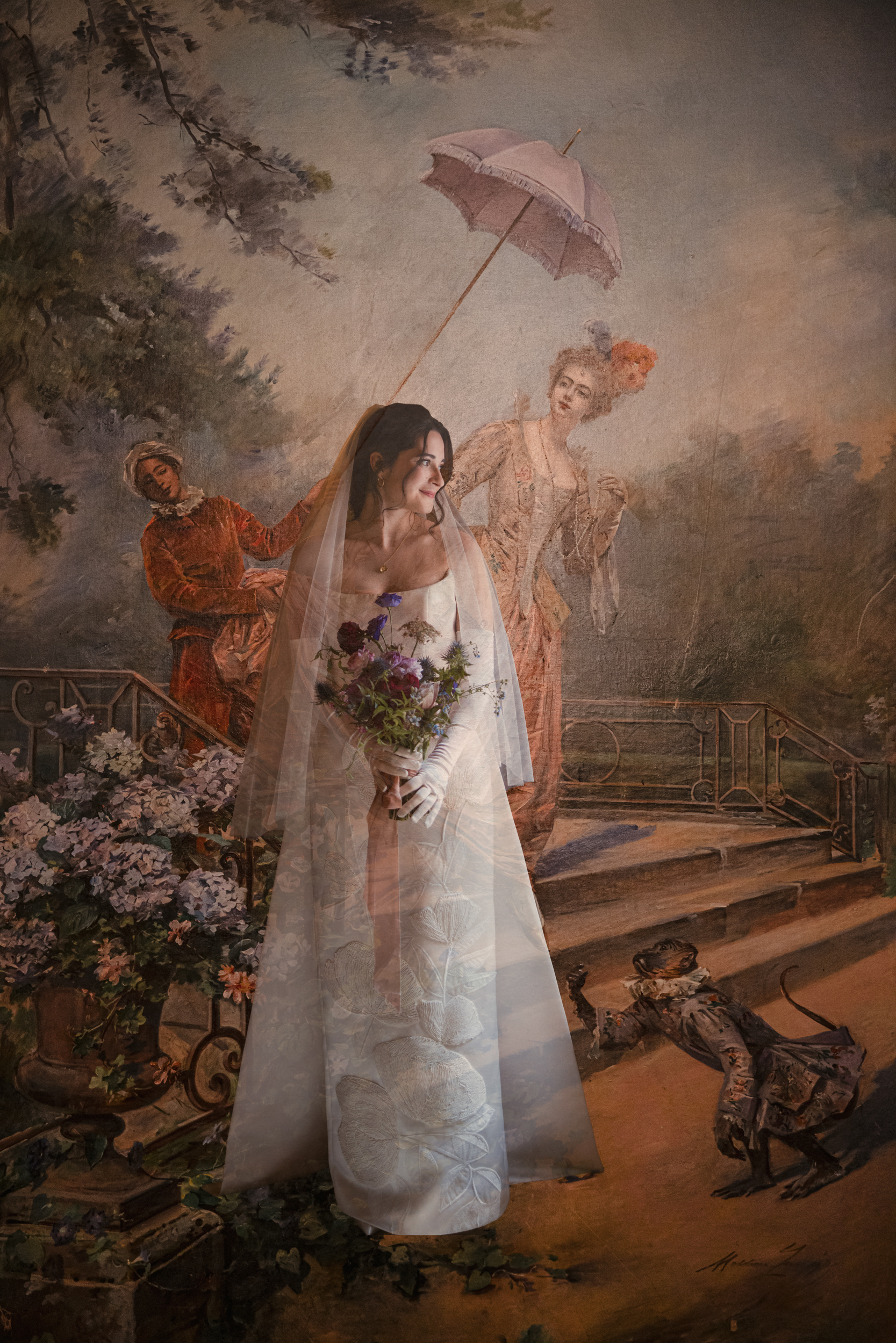 A bride in a white dress and veil holding a bouquet stands in front of a mural depicting figures with flowers, a parasol, and a monkey, capturing the elegance and charm of a Lotte New York Palace wedding.
